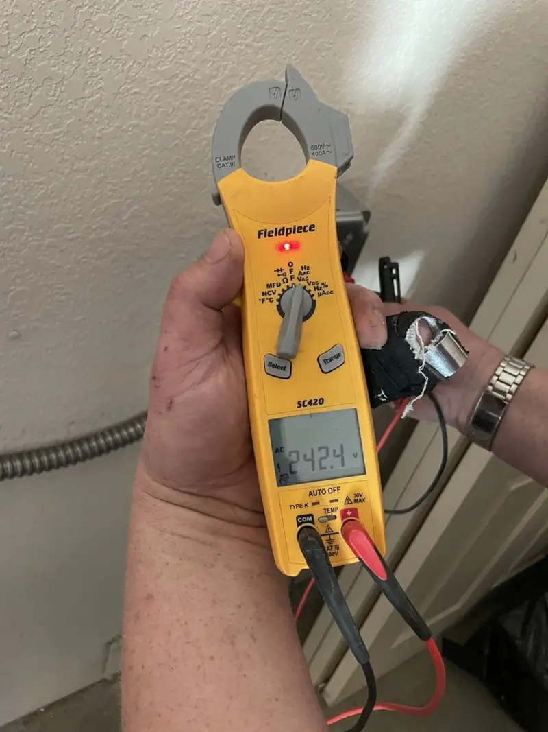 Voltage testing with clamp meter during Electrical Installation Services in Chattanooga Valley